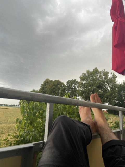 enjoying the thunderstorm on the balcony