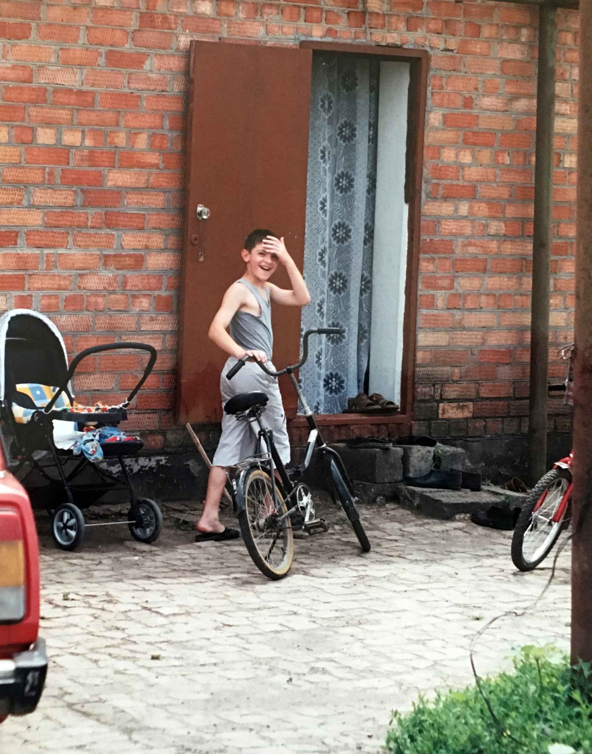 Alexander Fufaev on his first bike with his grandparents